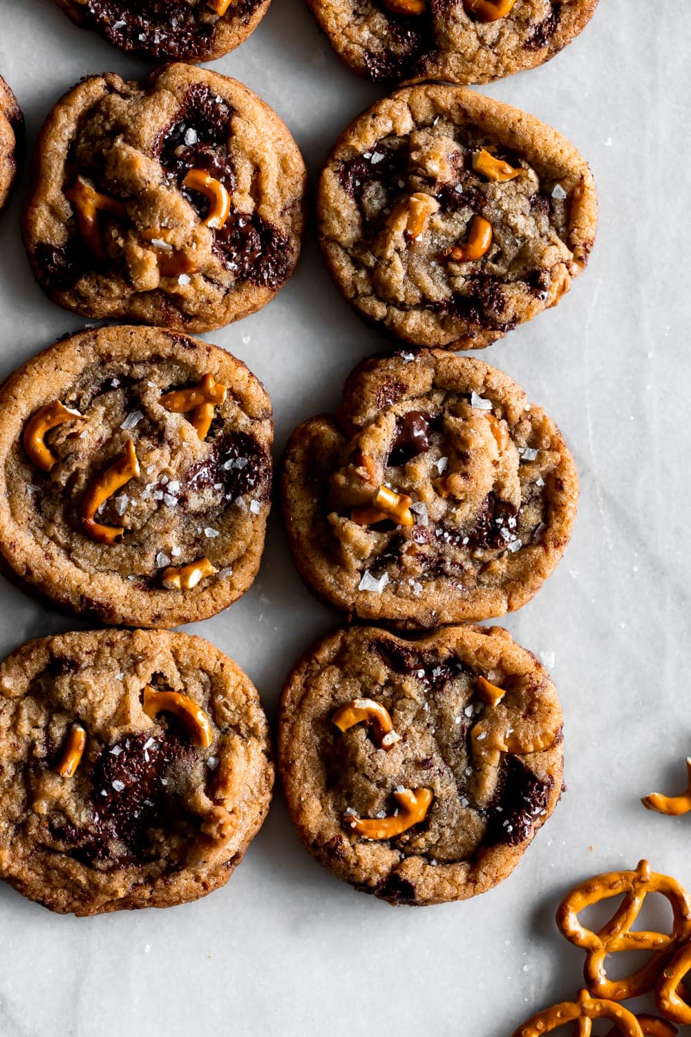 brown butter chocolate chip pretzel cookies on a marble slab