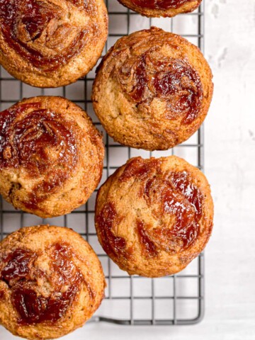 shot of muffins swirled with almond butter and guava jelly on top