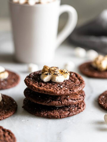Boozy hot chocolate cookies! Rich, soft, and chewy chocolate cookies spiked with your favorite liqueur and topped with gooey torched mini marshmallows.