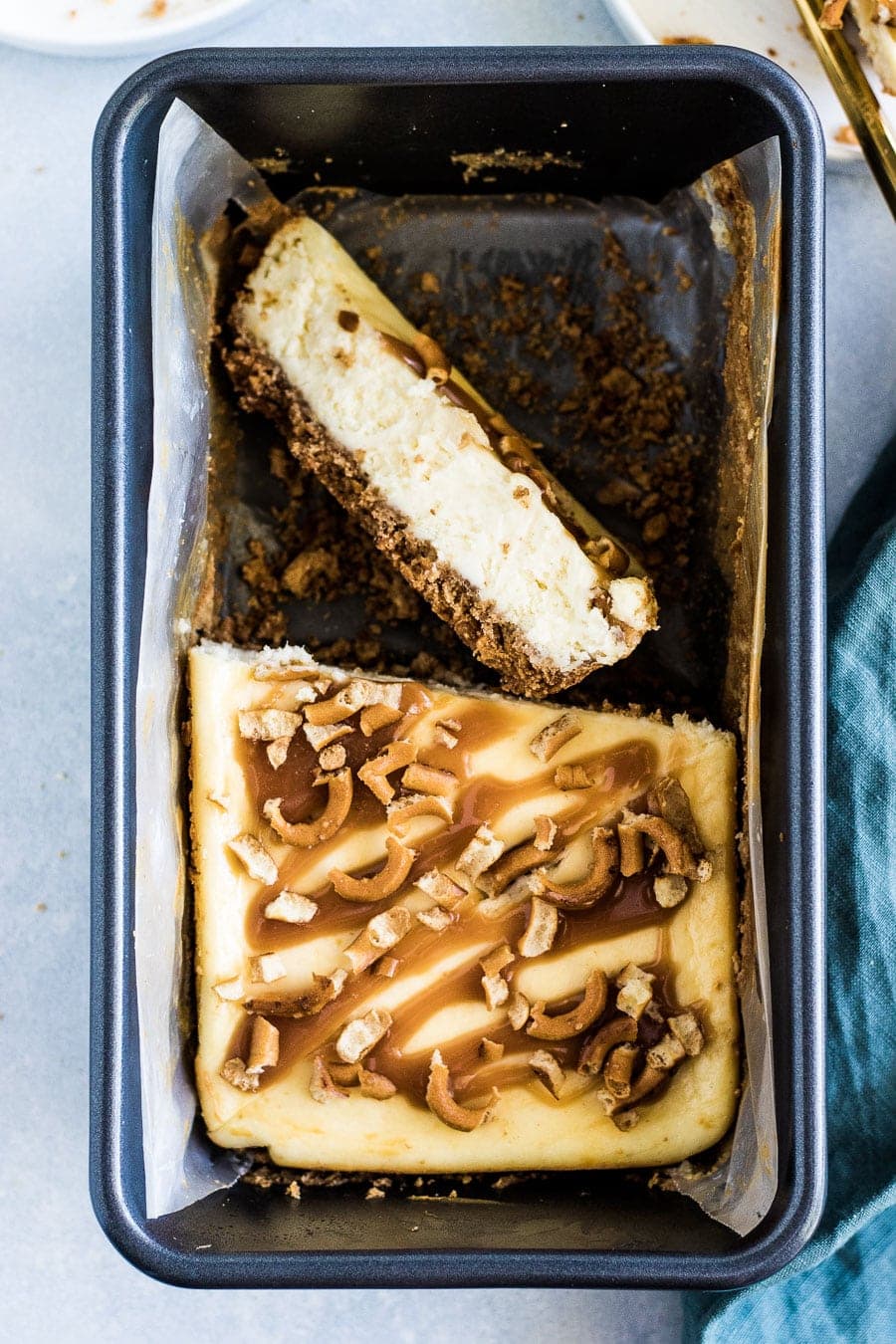 Deliciously creamy, small batch salted caramel pretzel cheesecake made with graham crackers, pretzels, and salted caramel.