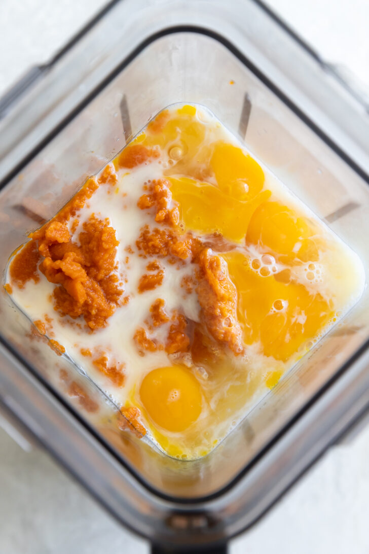 Creamy scrambled eggs with cheese in a blender, ready for cooking or breakfast preparation.