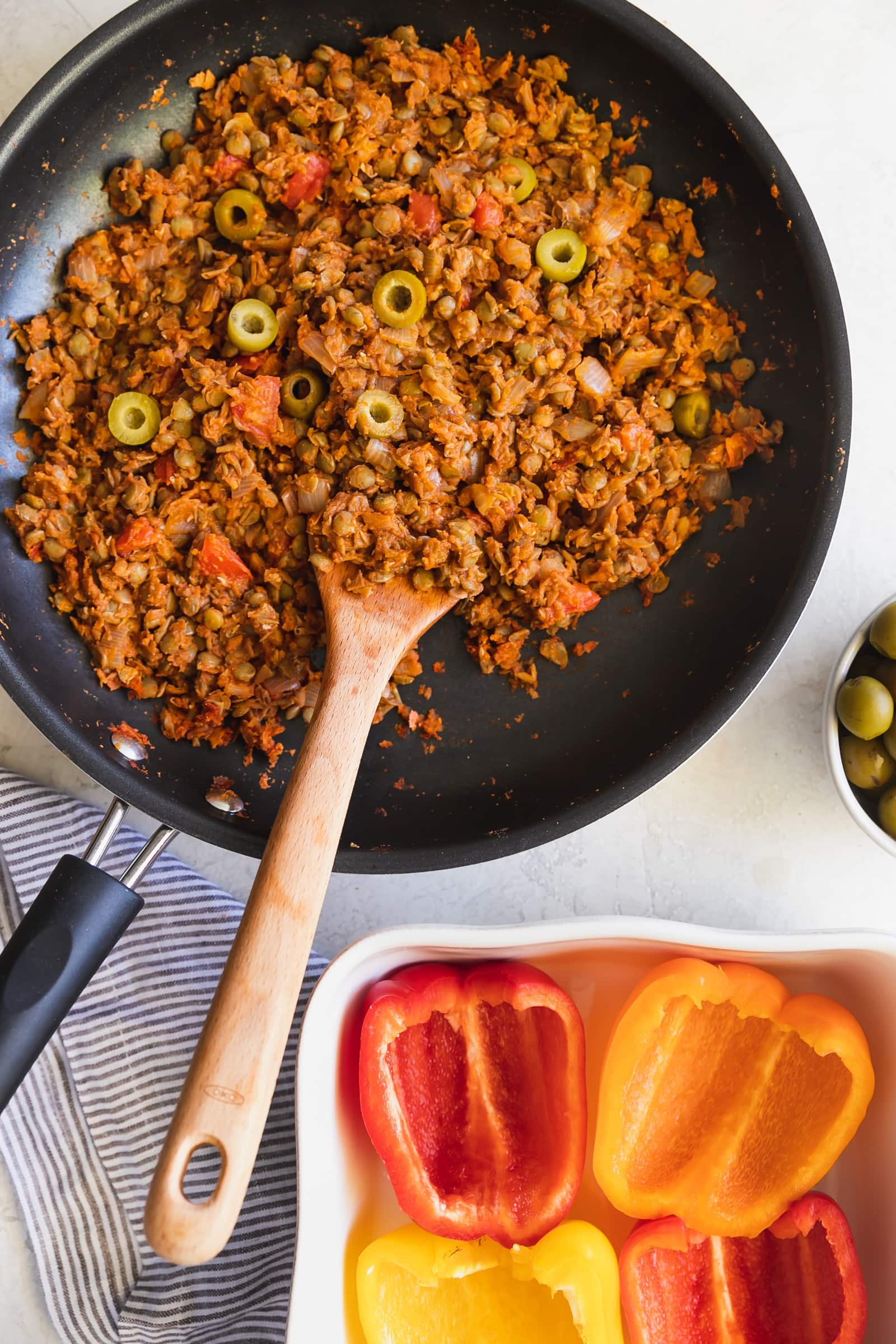 Cuban-Style Vegan Picadillo Stuffed Peppers. This vegan picadillo is a plant-based meal made Cuban-style with lentils, spices, onions, garlic, tomatoes, olives then stuffed in bell peppers. Perfect weeknight dinner!