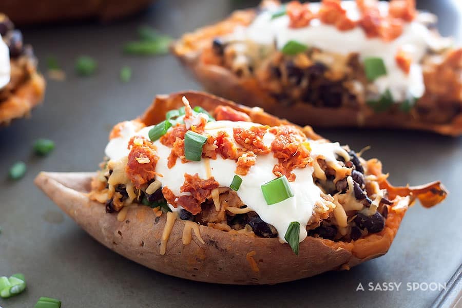 Crispy sweet potato skins loaded with gouda, chorizo, black beans, sour cream and scallions! Perfect for a weeknight meal, side dish, or game day!