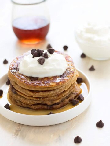 Fluffy, healthy, grain-free, dairy-free, refined sugar free, low carb chocolate chip pancakes made with almond flour, raw honey, and dark chocolate chips!