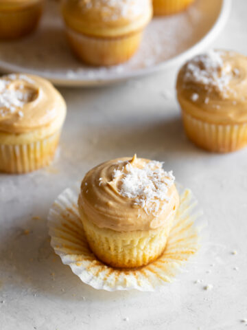 Cream Cheese Frosting Cupcakes with Coconut Topping - A Sassy Spoon.