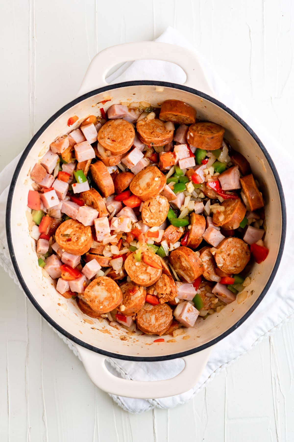 Making the lentil soup with chorizo, ham, Cuban sofrito, tomatoes, and spices.