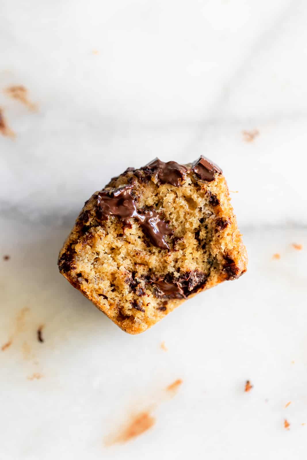 Half-eaten banana chocolate chip muffin