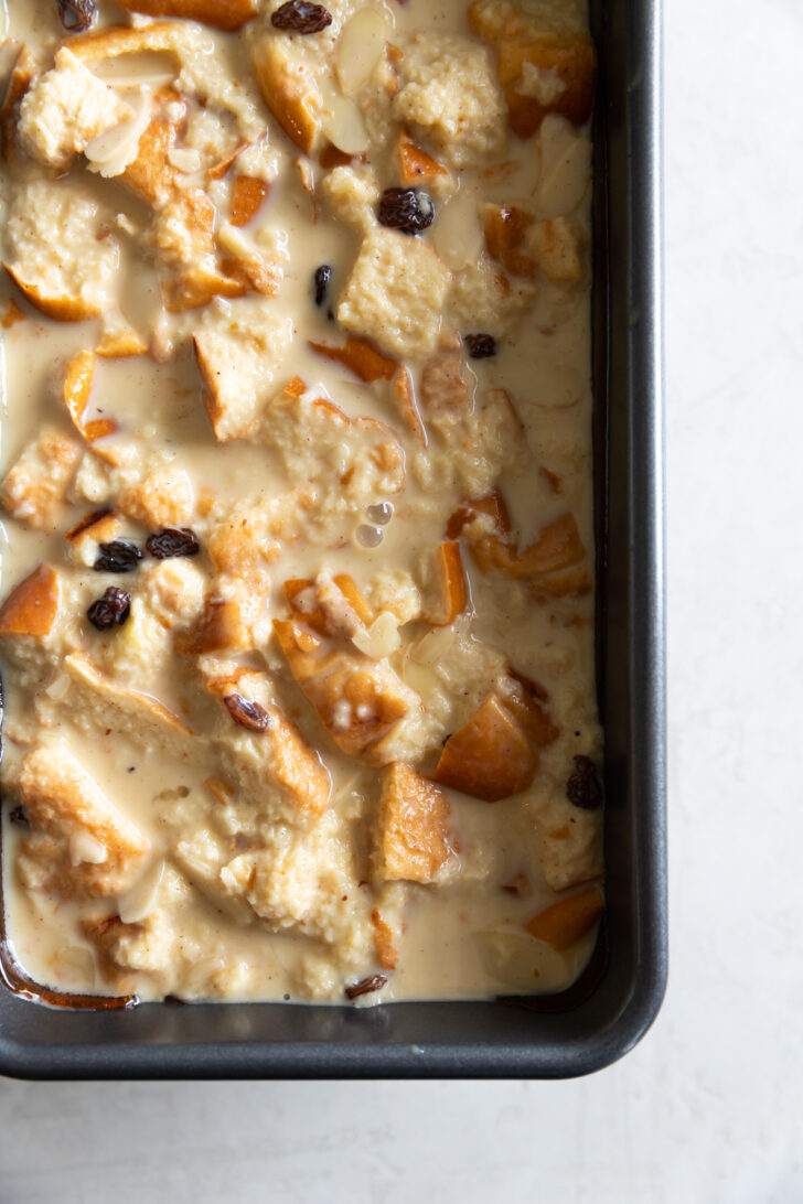 Creamy bread pudding with dried fruits and toasted nuts, a delicious dessert recipe.