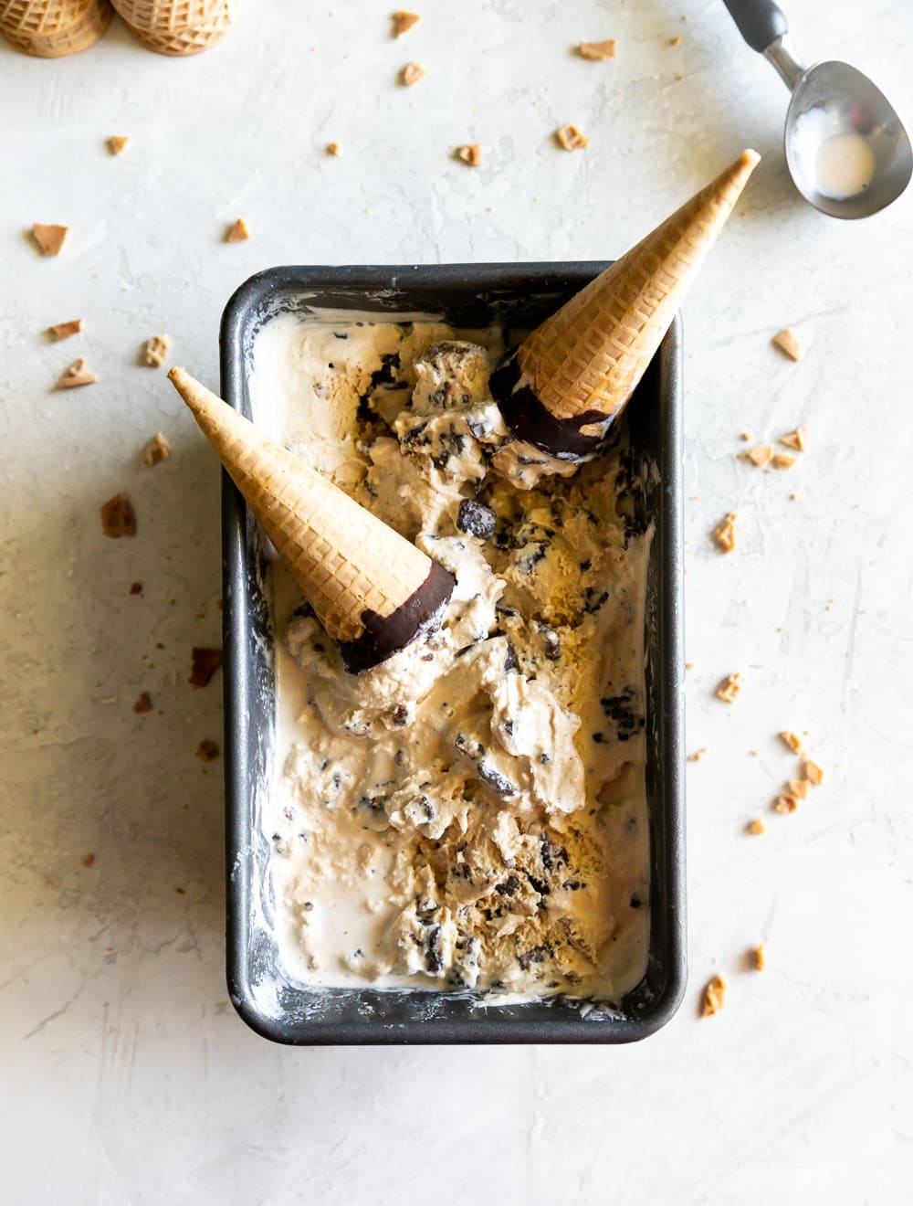 salted caramel ice cream in a loaf pan with chocolate dipped sugar cones