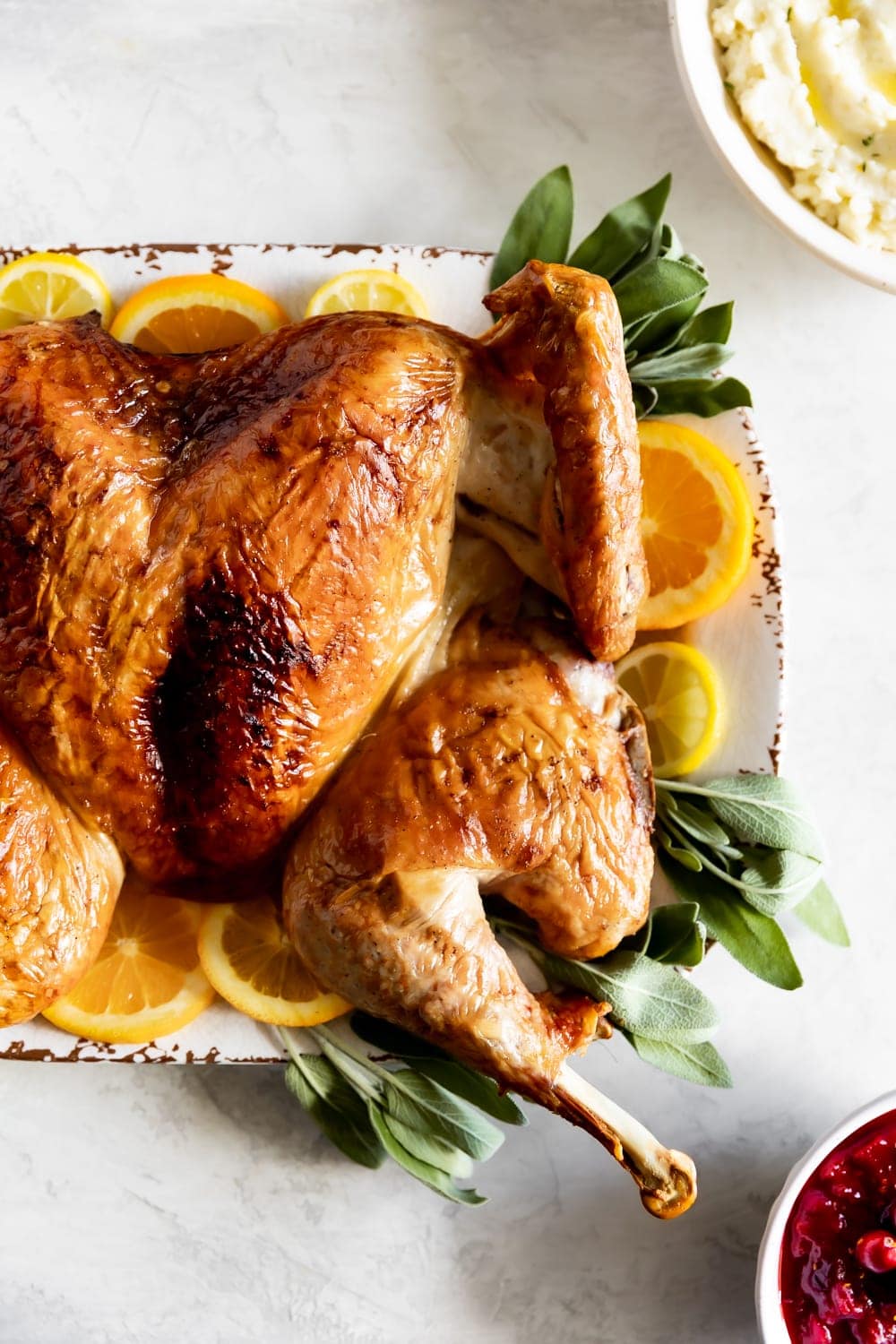 Whole raw chicken on a baking tray with scissors, ready for cooking or roasting. Best for delicious family meals and poultry recipes.