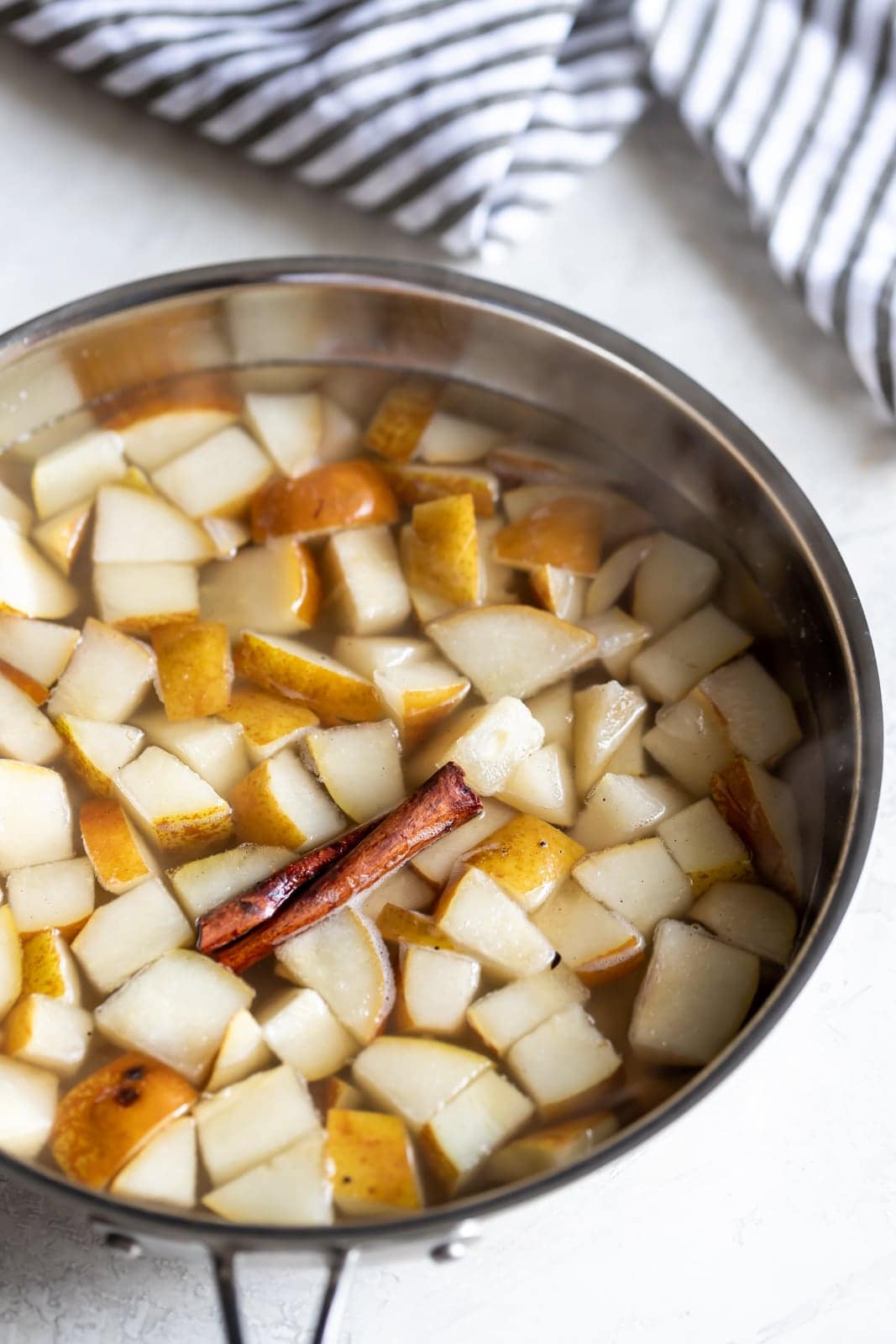 A deliciously fall-flavored red wine sangria made with pears, apples, sliced oranges and warm spices like cinnamon, ginger, and cardamom.