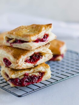 Leftover Cranberry + Turkey Turnovers. Repurpose Thanksgiving leftovers by making savory sweet pastelitos (or hand pies) using puff pastry sheets!